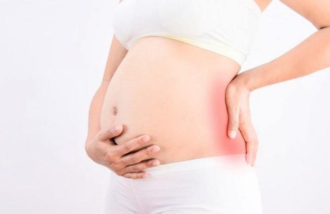 Đau lưng nhiều khi mang thai 4 tháng có sao không?