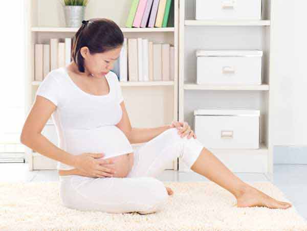 Tức vùng bẹn lan xuống cơ đùi và chân khi mang thai 8 tuần là sao?